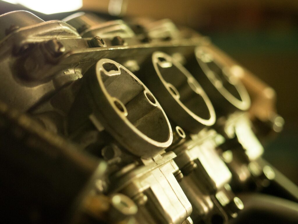 pexels-photo-6485909-6485909 Detailed view of a metal engine component showcasing precise engineering.